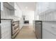 Modern kitchen featuring white cabinets, stainless steel appliances, and recessed lighting at 8444 15Th N Way, St Petersburg, FL 33702