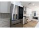 Contemporary kitchen featuring stainless steel appliances, white cabinets, and sleek countertops at 8444 15Th N Way, St Petersburg, FL 33702