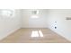 Bright laundry room with wood-look floors, and hookups for washer and dryer at 8444 15Th N Way, St Petersburg, FL 33702