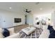 An open-concept living room featuring modern decor, white furnishings, wood flooring, and lots of light at 8444 15Th N Way, St Petersburg, FL 33702