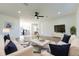 Inviting living room with white sofas, plush ottoman, elegant rug, and abundant natural light at 8444 15Th N Way, St Petersburg, FL 33702