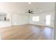 Open living area boasts wood floors, a ceiling fan, recessed lighting and access to the kitchen at 8444 15Th N Way, St Petersburg, FL 33702