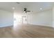 Open-concept living room features light wood floors and plenty of natural light at 8444 15Th N Way, St Petersburg, FL 33702