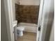 Well-lit bathroom with updated tile, modern vanity, and clean fixtures at 8502 Grapefruit Ave, Tampa, FL 33619