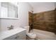 Modern bathroom with a new vanity, toilet, and tiled bathtub at 8502 Grapefruit Ave, Tampa, FL 33619