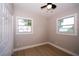 Bedroom features wood floors, dual windows and closet at 8502 Grapefruit Ave, Tampa, FL 33619