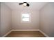 Cozy bedroom featuring a ceiling fan and bright window at 8502 Grapefruit Ave, Tampa, FL 33619