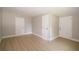Neutral bedroom features fresh paint, vinyl floors, and ample closet space at 8502 Grapefruit Ave, Tampa, FL 33619