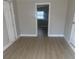 Cozy bedroom with neutral walls, updated floors, and closet storage at 8502 Grapefruit Ave, Tampa, FL 33619