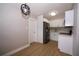 Modern kitchen featuring stainless steel appliances, stylish white cabinets, and beautiful lighting at 8502 Grapefruit Ave, Tampa, FL 33619