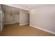 The open concept living area features wood-look floors and neutral paint colors at 8502 Grapefruit Ave, Tampa, FL 33619