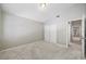 This bedroom with neutral carpet and fresh paint features a double-wide closet, providing lots of storage at 8514 Manassas Rd, Tampa, FL 33635