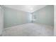 This bedroom features carpet flooring, neutral walls, and a window at 8514 Manassas Rd, Tampa, FL 33635