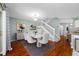 Dining room featuring hardwood floors and a table with six chairs, with easy access to the kitchen at 8514 Manassas Rd, Tampa, FL 33635