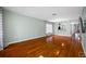 Spacious living room showcasing beautiful hardwood floors and ample natural light through large windows at 8514 Manassas Rd, Tampa, FL 33635