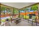 Covered patio features outdoor seating with views of the backyard at 8514 Manassas Rd, Tampa, FL 33635