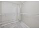 A walk-in closet featuring carpet flooring, ample shelving, and a mirror at 8514 Manassas Rd, Tampa, FL 33635