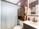 A simple bathroom with tile floors, modern sink, and a decorative mirror at 8556 91St Ter, Seminole, FL 33777