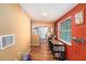 Hallway featuring hardwood floors, a neutral color palette, and built-in desk space, ideal for a home office at 8556 91St Ter, Seminole, FL 33777