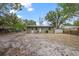 Exterior view of the back of the house with a spacious backyard at 9213 W Robson St, Tampa, FL 33615