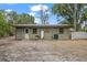 The back of the house, showing the exterior with outdoor utilities in the spacious backyard at 9213 W Robson St, Tampa, FL 33615