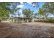A view of the house from the backyard, showing the outdoor area and exterior of the home at 9213 W Robson St, Tampa, FL 33615