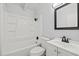 Bathroom with a shower and tub combination with modern fixtures at 9213 W Robson St, Tampa, FL 33615