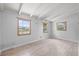 Bedroom featuring three windows that provide lots of natural light and wood floors at 9213 W Robson St, Tampa, FL 33615