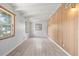 Bedroom featuring three windows that provide lots of natural light and wood floors at 9213 W Robson St, Tampa, FL 33615