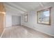 Bedroom featuring two windows that provide lots of natural light and wood floors at 9213 W Robson St, Tampa, FL 33615