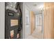 Hallway with tile floors and access to different rooms in the house at 9213 W Robson St, Tampa, FL 33615