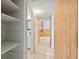 Hallway with tile floors and access to different rooms in the house at 9213 W Robson St, Tampa, FL 33615
