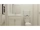 Bathroom featuring a toilet, undermounted sink with vanity, framed mirror, and subway tiled shower at 9604 Runaway Breeze Dr, Land O Lakes, FL 34637