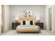 Bedroom featuring a bed, decorative lamps, side tables, a gray rug, and an animal photograph at 9604 Runaway Breeze Dr, Land O Lakes, FL 34637