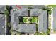 Aerial view showcases a courtyard with lush landscaping and charming walkways at 9731 Meadow Field Cir, Tampa, FL 33626