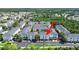 Aerial view of townhomes surrounded by trees and green spaces at 9731 Meadow Field Cir, Tampa, FL 33626