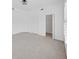 A vacant bedroom offers plush neutral carpeting, a ceiling fan, a window with shutters, and a walk-in closet at 9731 Meadow Field Cir, Tampa, FL 33626