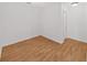 Empty bedroom featuring hardwood floors and white walls at 9731 Meadow Field Cir, Tampa, FL 33626