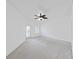 This airy room has neutral carpeting, a ceiling fan, and windows/doors providing natural light and views at 9731 Meadow Field Cir, Tampa, FL 33626