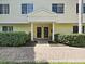 Inviting entrance showcases a well-maintained walkway leading to charming front doors with elegant accents at 9731 Meadow Field Cir, Tampa, FL 33626