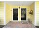 Charming dual entrances with decorative wreaths and lanterns create a welcoming and stylish entryway at 9731 Meadow Field Cir, Tampa, FL 33626