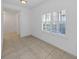 Versatile flex space with large windows and tile flooring offers ample natural light at 9731 Meadow Field Cir, Tampa, FL 33626