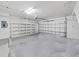 Spacious garage with ample room for parking and storage on shelving at 9731 Meadow Field Cir, Tampa, FL 33626