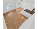 Loft view of the living room with hardwood floors and modern kitchen with island at 9731 Meadow Field Cir, Tampa, FL 33626