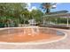 Community splash pad with a fountain and covered seating at 9731 Meadow Field Cir, Tampa, FL 33626