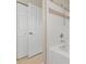 Bathroom with a shower and a closet for storage at 9842 Lake Chase Island Way, Tampa, FL 33626