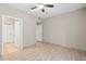 Bedroom features neutral colors, porcelain tile flooring, and two doors at 9842 Lake Chase Island Way, Tampa, FL 33626
