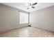 Open bedroom with neutral colored walls and porcelain tile flooring at 9842 Lake Chase Island Way, Tampa, FL 33626