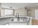 Modern kitchen with a double basin stainless steel sink and modern faucet at 9842 Lake Chase Island Way, Tampa, FL 33626