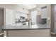 Bright kitchen with stainless steel appliances and gray countertops at 9842 Lake Chase Island Way, Tampa, FL 33626